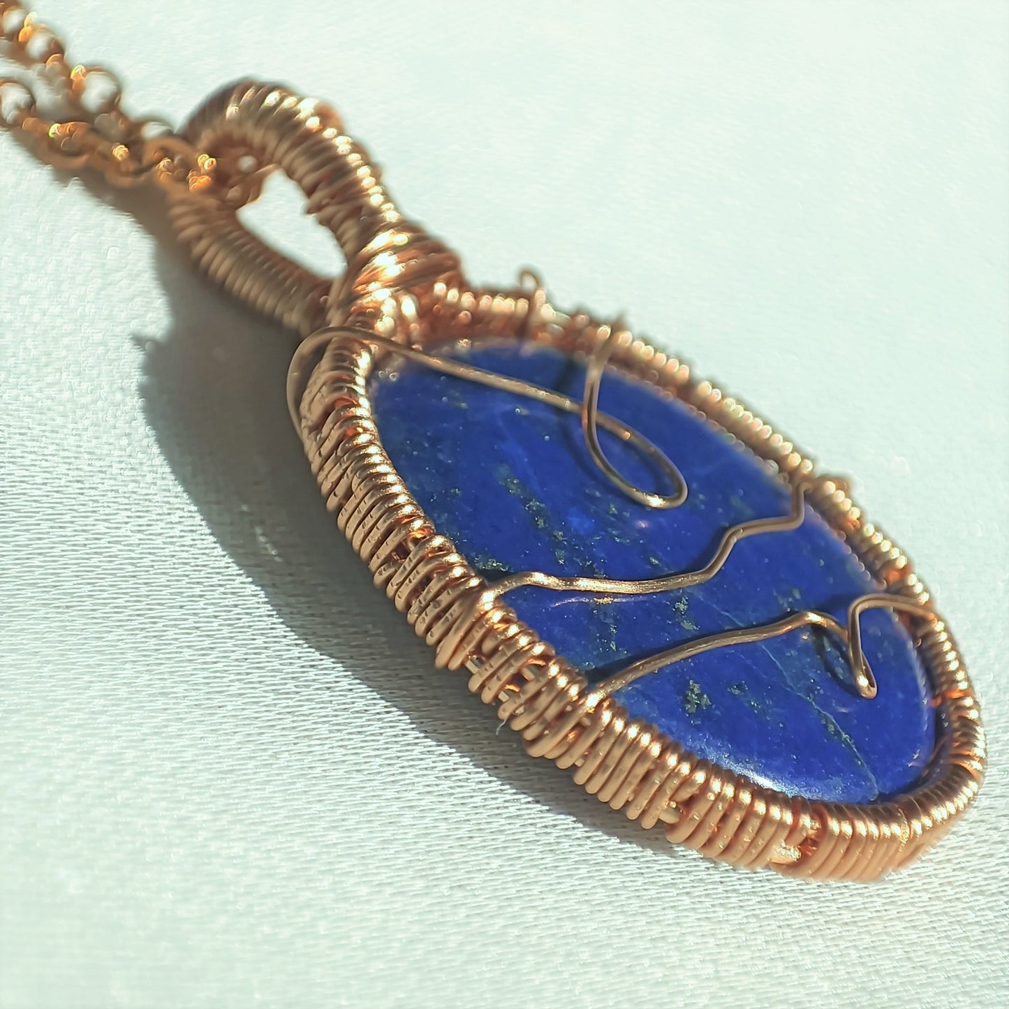 Hand woven lapis lazuli pendant