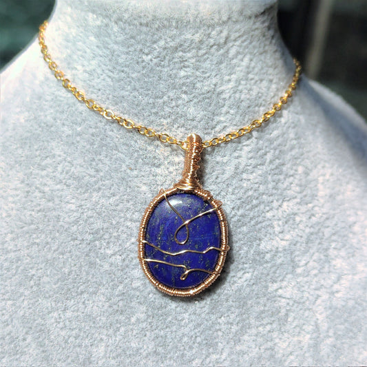Hand woven lapis lazuli pendant